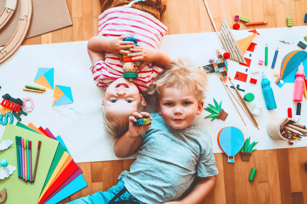 istock Kids draw and make crafts. Background for preschool and kindergarten or art classes. 1173451699