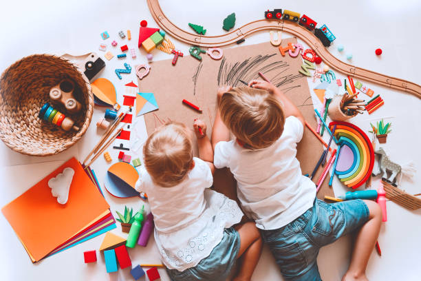 istock Kids draw and make crafts. Background for preschool and kindergarten or art classes. 1173452159