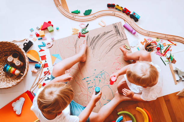 istock Kids draw and make crafts. Background for preschool and kindergarten or art classes. 1173452395