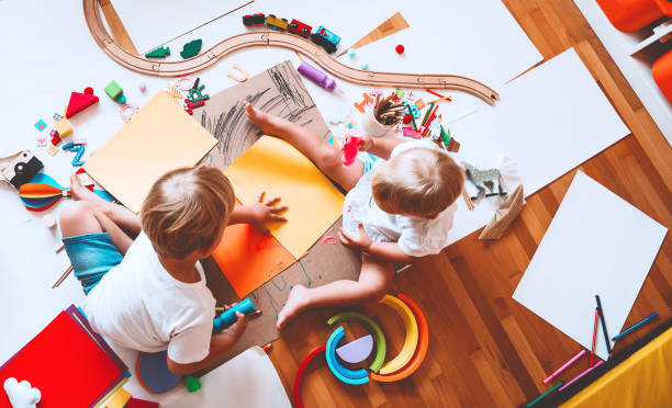 istock Kids draw and make crafts. Background for preschool and kindergarten or art classes. 1173452404