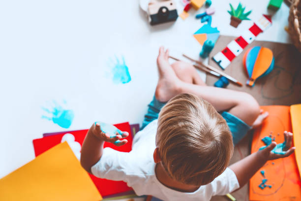 istock Kids draw and make crafts. Background for preschool and kindergarten or art classes. 1173452418