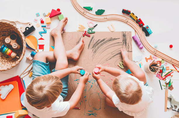 istock Kids draw and make crafts. Background for preschool and kindergarten or art classes. 1173452452