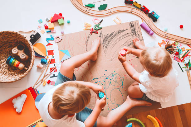 istock Kids draw and make crafts. Background for preschool and kindergarten or art classes. 1173452455