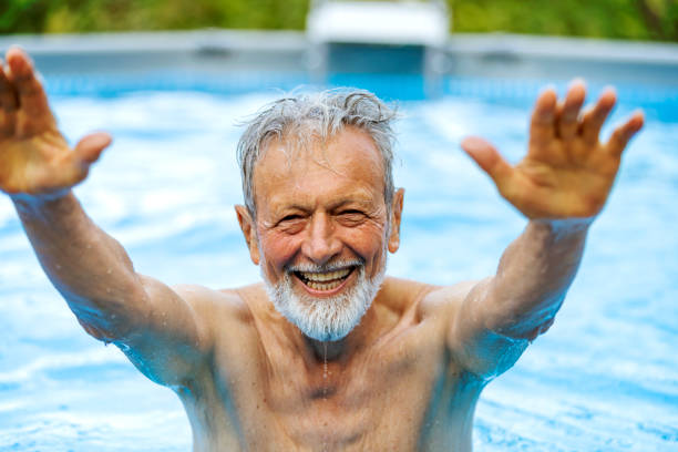 istock Senior retired male in a pool 1173454752