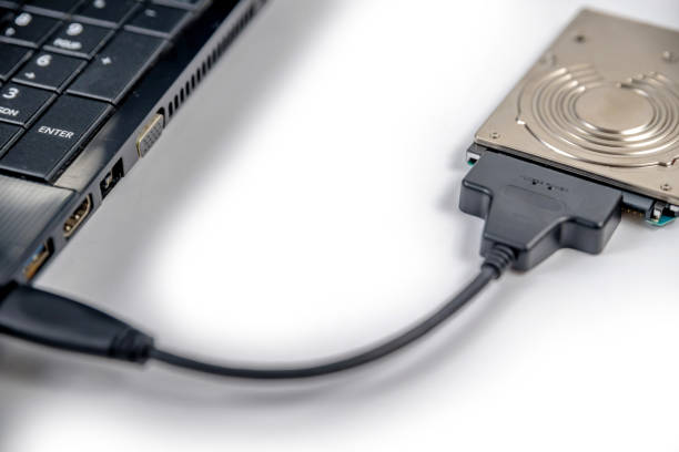 istock hdd 2.5 internal hard drive disk connected to laptop via sata usb cable closeup view 1173455373