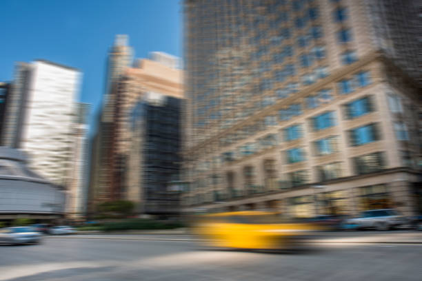 istock Downtown skyscrapers with BLURED yellow cab / City concept (Click for more) 1173460182