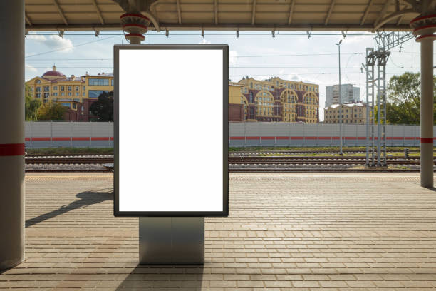 Blank billboard poster stand mock up on platform of raillway station Blank billboard poster stand mock up on platform of railway station. 3d illustration. railroad station platform stock pictures, royalty-free photos & images