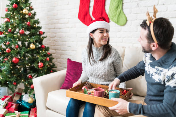 istock Couple Having Snacks At Home During Christmas 1173465635
