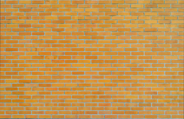 istock Brick wall texture background in yellow brown tone 1173466227