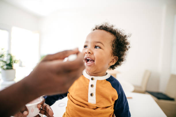 istock Toddler eating yogurt 1173466497