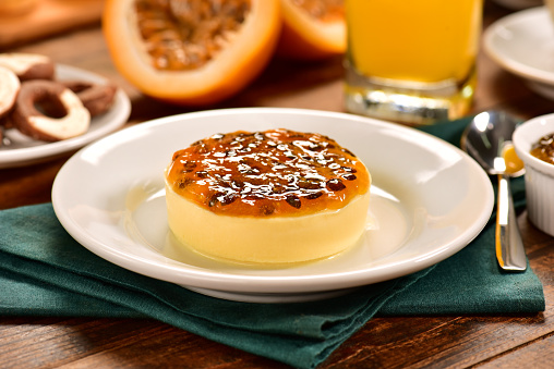 Passion fruit individual cheesecake on decorated scene