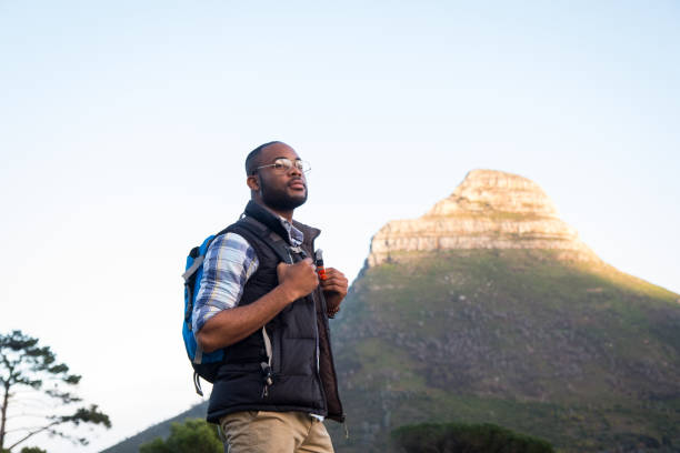 istock African man enjoying his hike on the mountain 1173480740