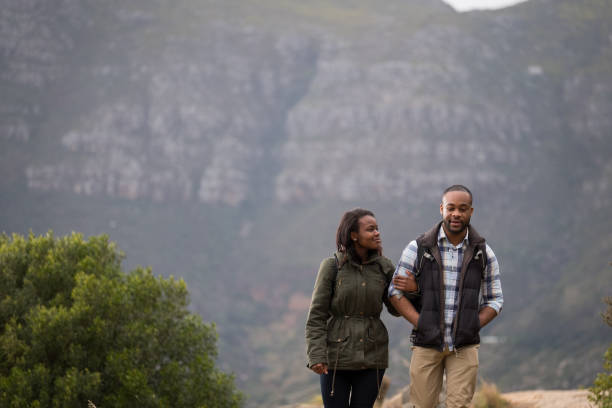 istock African couple hiking arm in arm 1173484947