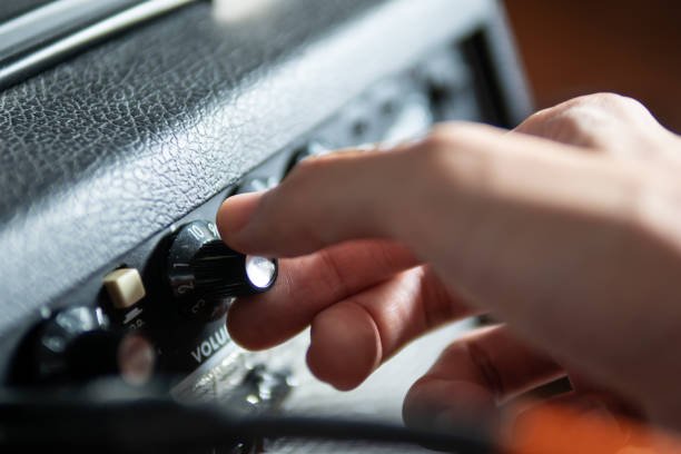 This detail view features the knobs of a vintage amplifier. The clean lines and minimalist design are typical of high-quality audio equipment from past decades. Ideal for articles on classic audio gear, collectors, and retro tech enthusiasts