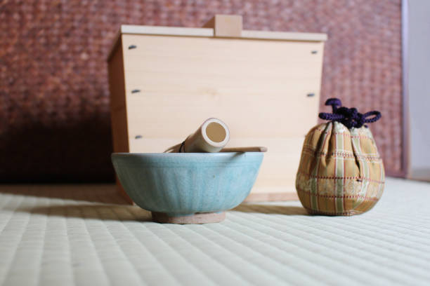 istock Making matcha green tea with pottery tea cup and bamboo whisk 1173485622