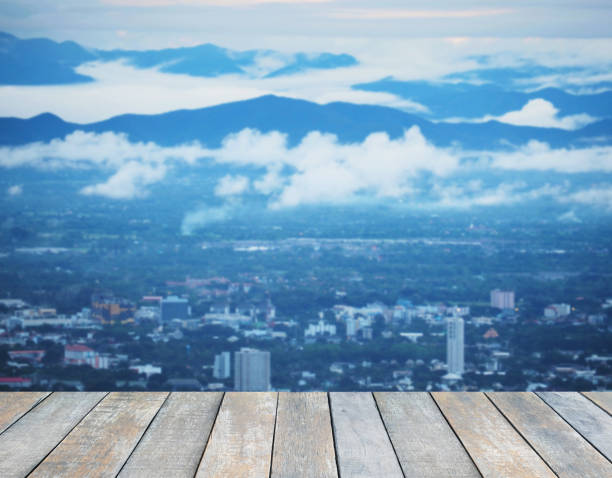 istock Wood table top over city scape 1173486496