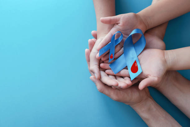 Light blue ribbons with blood on blue background , world diabetes day stock photo