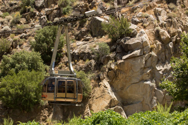 Palm Springs Aerial Tramway Palm Springs, California / USA - June 30,  2019: The Palm Springs Aerial Tramway whisks people up the side of Mount San Jacinto to the forested top. aerial tramway stock pictures, royalty-free photos & images