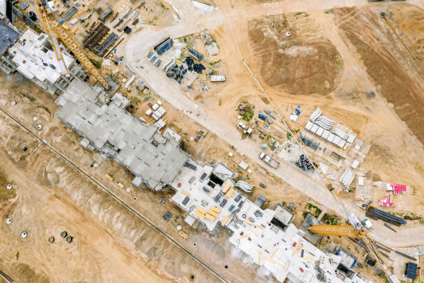istock aerial top view of yellow cranes working at construction site. view from drone 1173497618