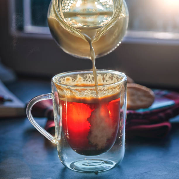 istock Pouring Milk into Cup of Coffee 1173501931