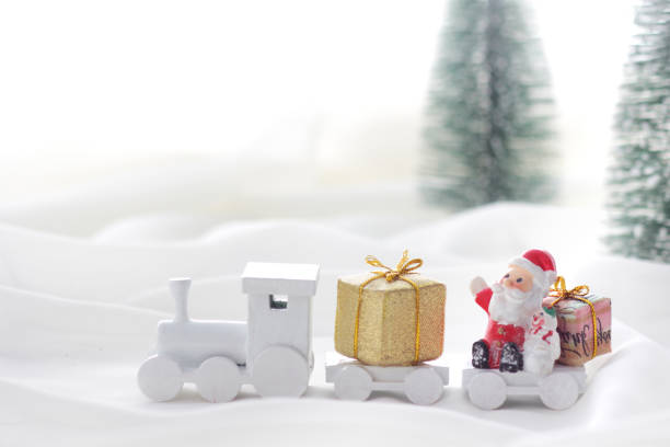 istock Santa Claus comes with a present on the train 1173502106