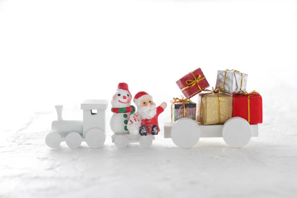 istock Santa Claus comes with a present on the train 1173502109