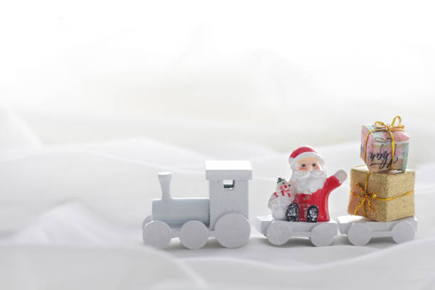 istock Santa Claus comes with a present on the train 1173502334