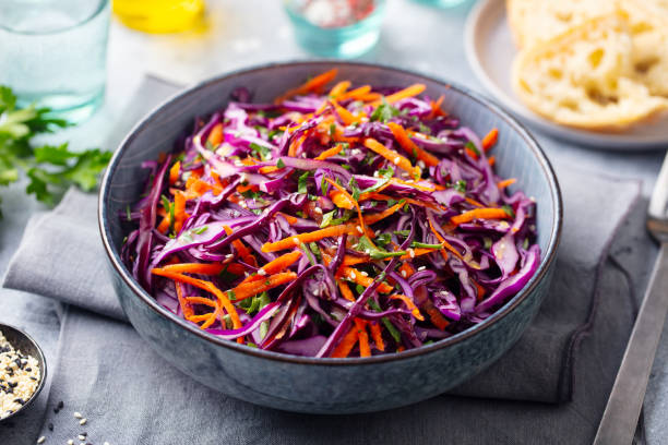 istock Red cabbage salad, Coleslaw in a bowl. Grey background. Close up. 1173502911
