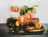 Spritz cocktail in glasses with orange slices and ice