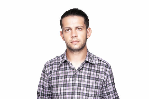 Portrait of a serious young man over white background