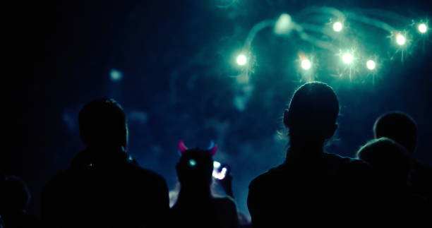 istock Crowd watching fireworks and celebrating new year eve 1173512705