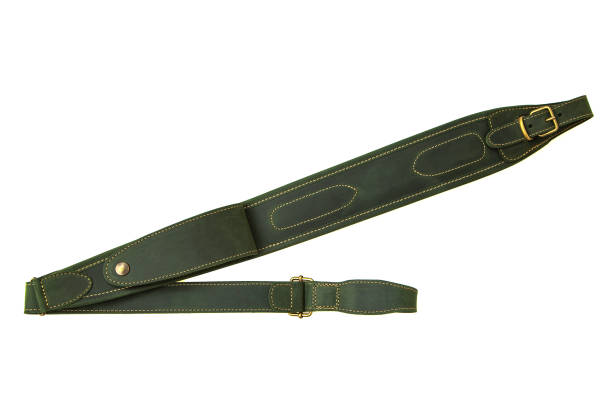 istock Green leather shoulder strap for a gun isolated on white background 1173513653