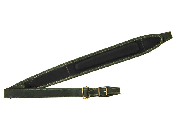 istock Green leather shoulder strap for a gun isolated on white background 1173513659