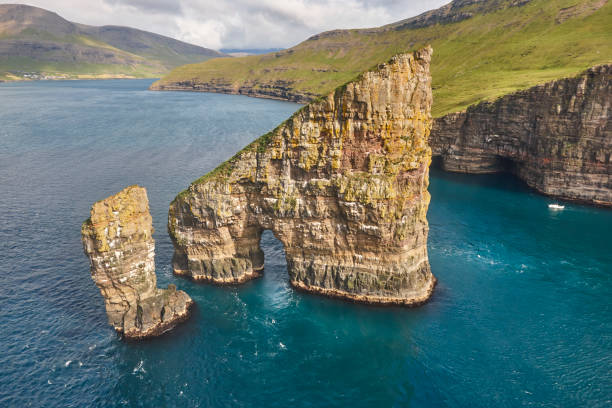 istock Faroe islands dramatic coastline viewed from helicopter. Vagar cliffs 1173515306