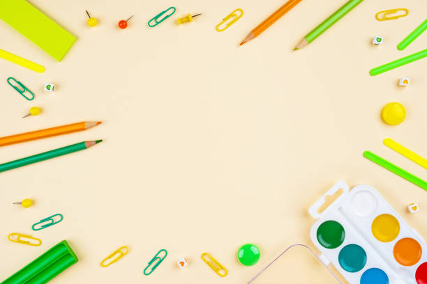 istock School accessories on a yellow background. Pastel colored. 1173517212