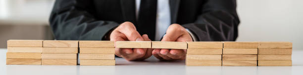 istock Conceptual image of business merger 1173518333