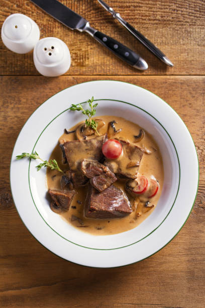 istock Braised veal cheeks in cream sauce with mushrooms 1173518826