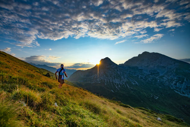 istock Skyrunner runner runs in the mountains as the sun rises 1173520130