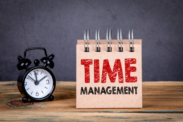 Time management concept Time management concept. Alarm clock and notebook on a wooden table time management stock pictures, royalty-free photos & images