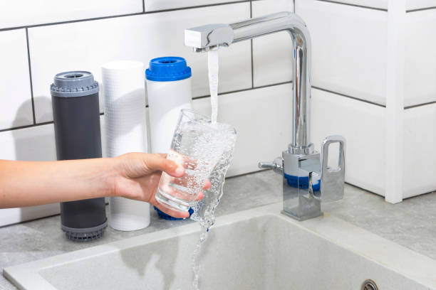 istock The tap from which water flows. Quenching thirst. Water problems in some countries.The glass is filled with water. 1173523054