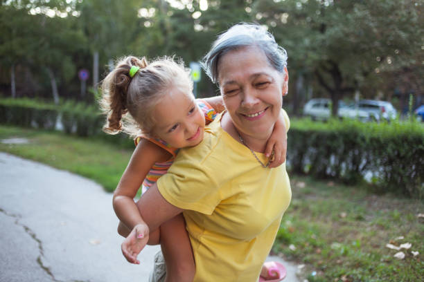 istock Grandma holding her granddaughter 1173526349