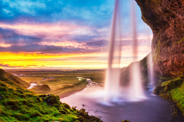 Cascata seljalandsfoss al tramonto, Islanda - foto stock