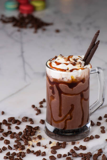 istock Chocolate and caramel milkshakes. Cream with caramel sauce on 1173527310