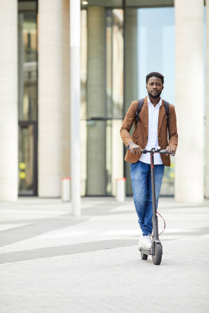istock African-American Man Riding Electric Scooter 1173528164