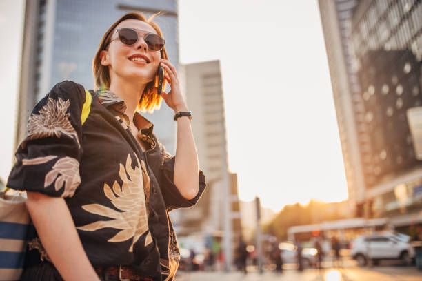istock Beautiful young woman on mobile 1173529263