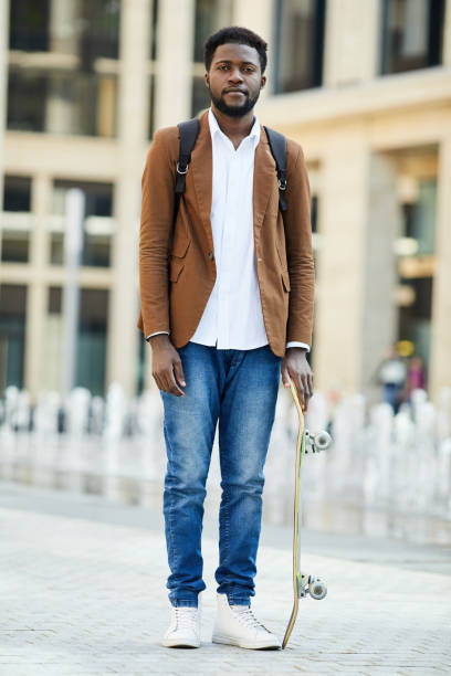 istock Modern African-American Student Posing Outdoors 1173529278