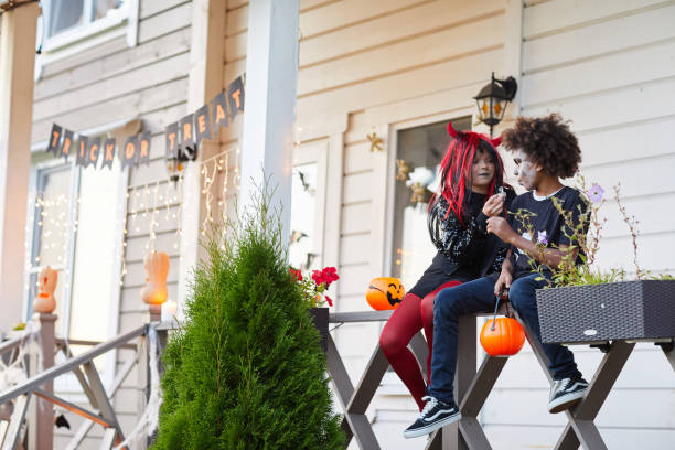 istock Kids eating Candy on Halloween 1173531053