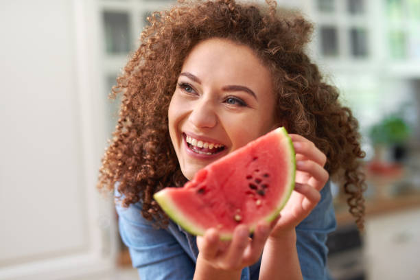 istock Woman with a slice of watermelon 1173531293