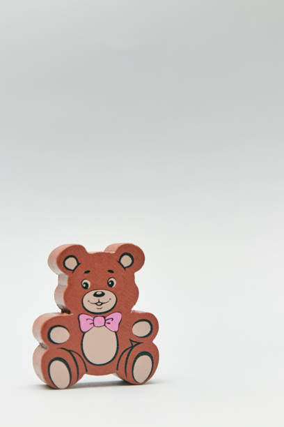 istock Children's wooden retro toy Teddy bear alone on a light background. space for text. copy space. 1173531626