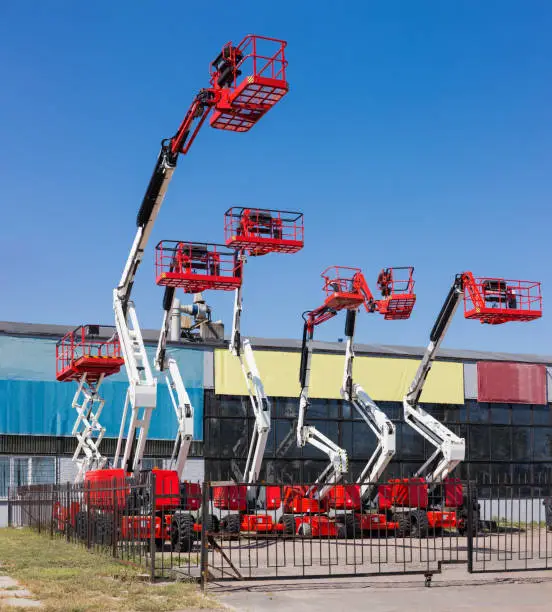 Photo of Different self propelled articulated boom lifts and one scissor lift